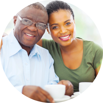 African elderly man and caregiver smiling to the camera